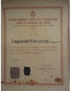 Attestato + distintivo in argento da mutilato sul lavoro1939
